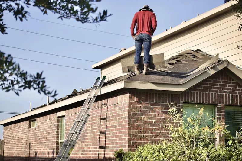 Professional roofer working on a residential roof in Menlo Park